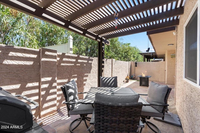 view of patio featuring outdoor dining space, a fenced backyard, and a pergola