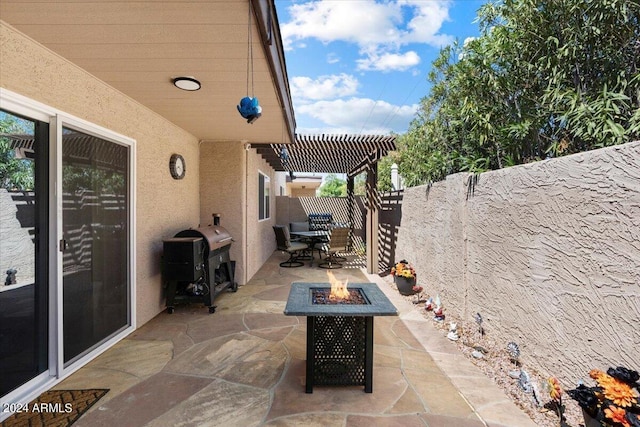 view of patio featuring a pergola, a grill, a fenced backyard, and an outdoor fire pit