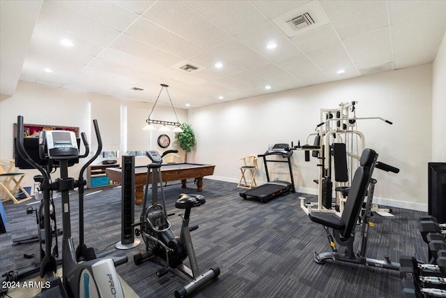 exercise room featuring billiards, visible vents, dark colored carpet, and baseboards