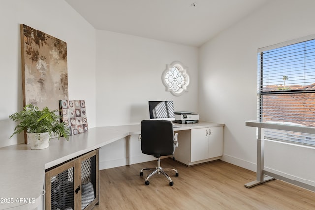 office area with light wood-type flooring and baseboards