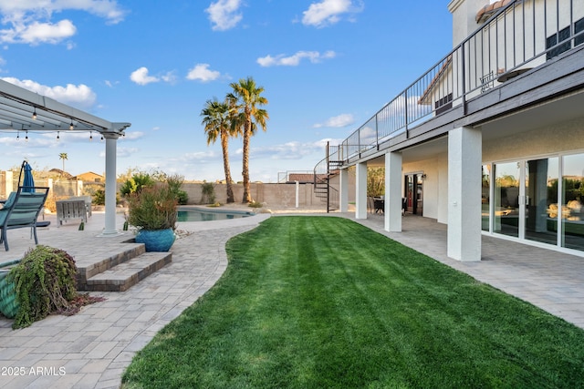 view of yard with a fenced in pool, a patio, a fenced backyard, and stairs