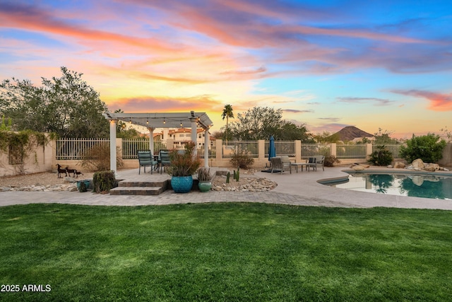 exterior space featuring a patio area, fence, and a lawn