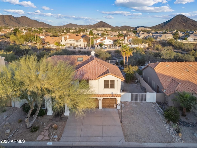 drone / aerial view with a mountain view and a residential view