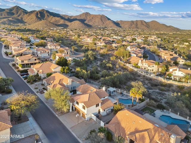 birds eye view of property with a mountain view and a residential view