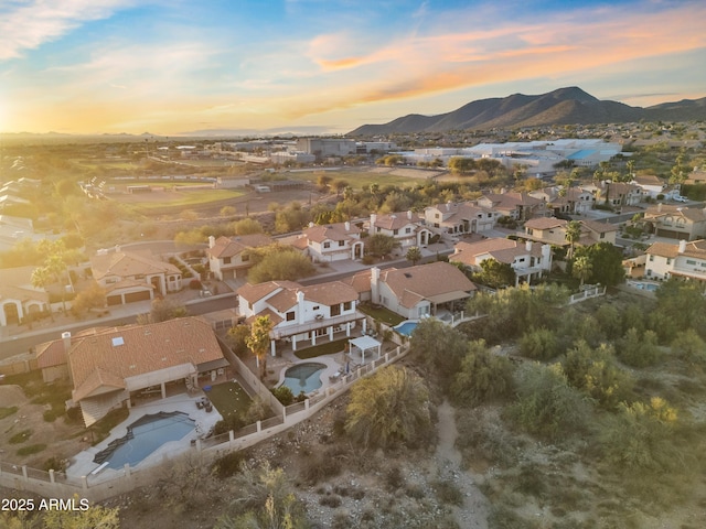 drone / aerial view featuring a residential view and a mountain view