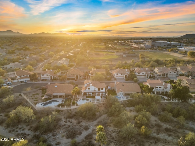 drone / aerial view featuring a residential view and a mountain view