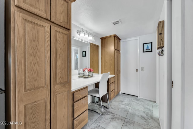 bathroom with a textured ceiling