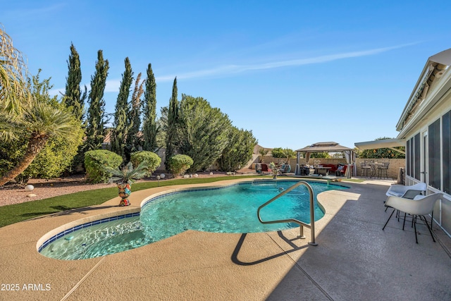 view of swimming pool with a patio area, a gazebo, and an outdoor bar