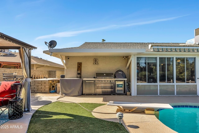 back of house featuring a patio area and area for grilling