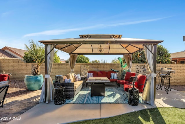 view of patio featuring a gazebo and an outdoor hangout area