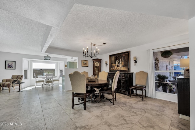 dining area with an inviting chandelier