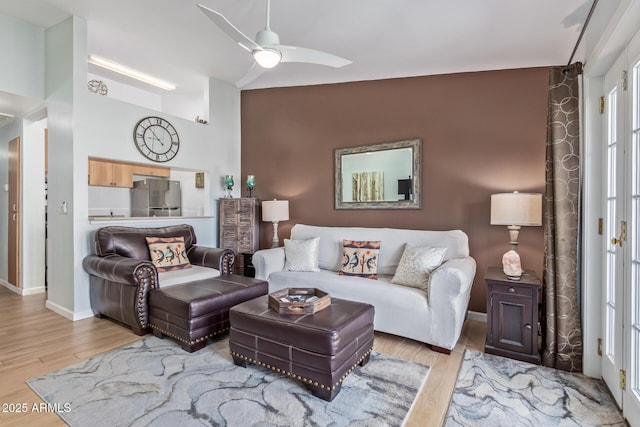 14203 N 19th Ave Unit 2036, Phoenix, AZ 85023 - living area with wood finished floors, ceiling fan, high vaulted ceiling, and baseboards
