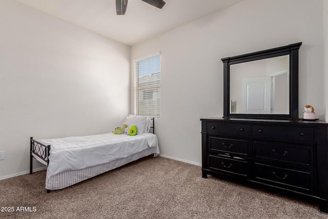 bedroom featuring ceiling fan and light carpet