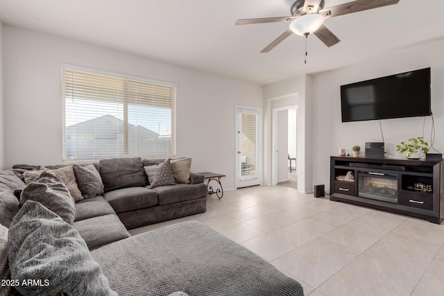 tiled living room featuring ceiling fan