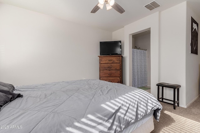 bedroom with ceiling fan and light colored carpet