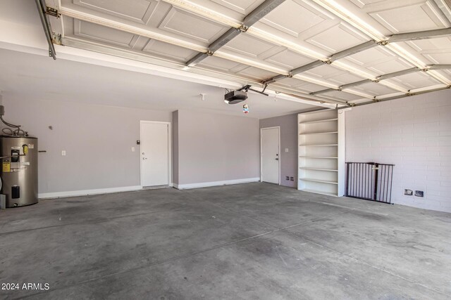 garage featuring a garage door opener and water heater