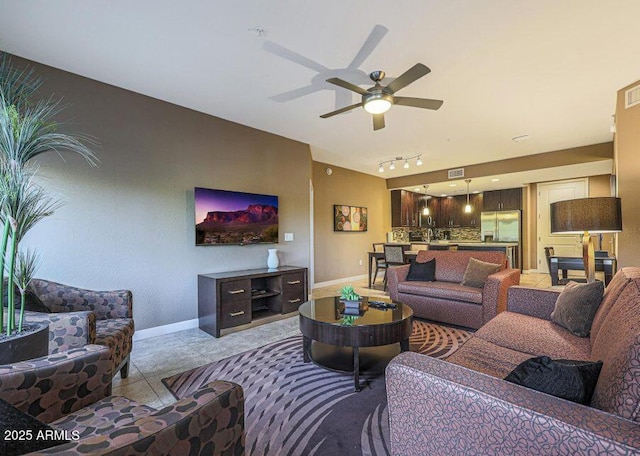 5450 E Deer Valley Dr Unit 2191, Phoenix, AZ 85054 - living area with baseboards, a ceiling fan, rail lighting, and light tile patterned floors