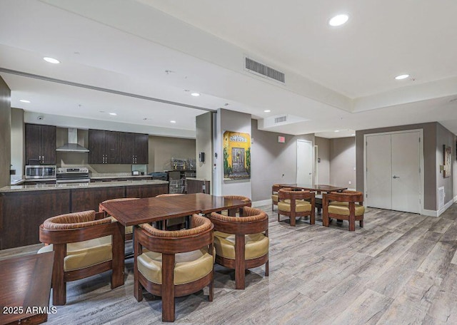 5450 E Deer Valley Dr Unit 2191, Phoenix, AZ 85054 - dining space with light wood-type flooring, baseboards, and recessed lighting