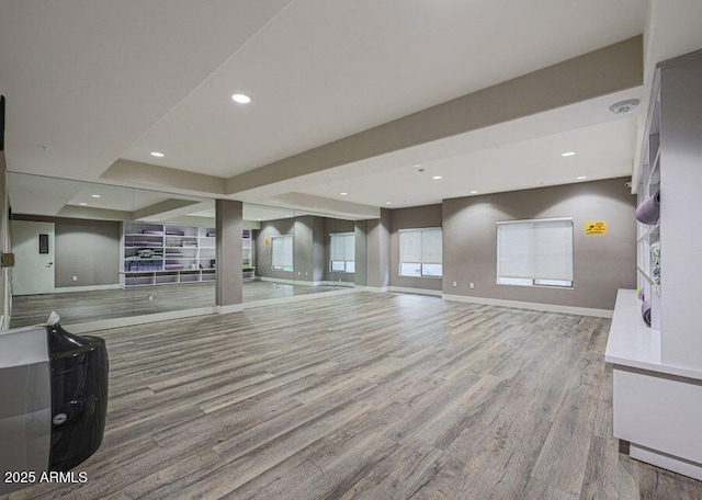 5450 E Deer Valley Dr Unit 2191, Phoenix, AZ 85054 - unfurnished living room featuring wood finished floors, recessed lighting, and baseboards