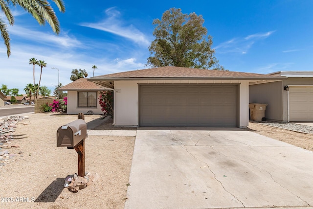 single story home with an attached garage and driveway