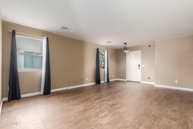 18359 W Eva St, Waddell, AZ 85355 - empty room featuring light wood-type flooring and baseboards