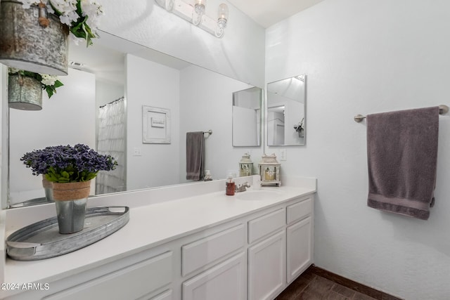 18359 W Eva St, Waddell, AZ 85355 - bathroom featuring vanity and wood finished floors