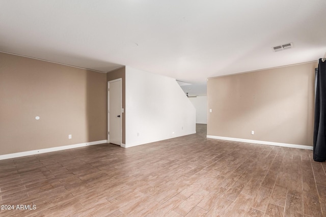 18359 W Eva St, Waddell, AZ 85355 - spare room featuring wood finished floors and baseboards