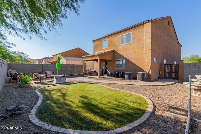 18359 W Eva St, Waddell, AZ 85355 - rear view of house featuring a patio area, a gate, central AC, and stucco siding