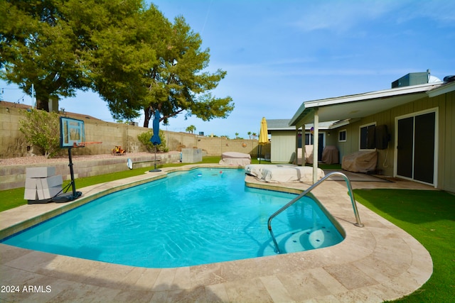 view of pool with a patio area, a fenced backyard, and a fenced in pool