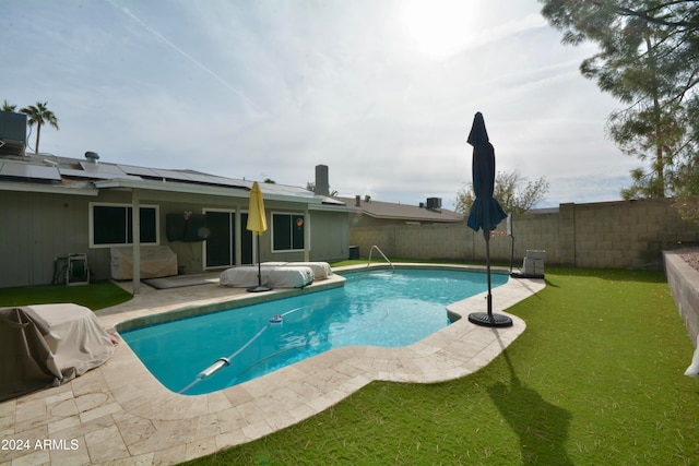 view of pool featuring a fenced in pool, a lawn, a patio, a fenced backyard, and grilling area