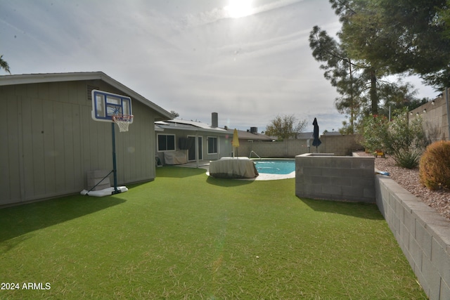 view of yard with a fenced in pool and a fenced backyard