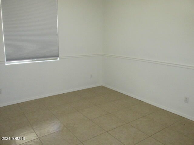 empty room featuring tile patterned flooring