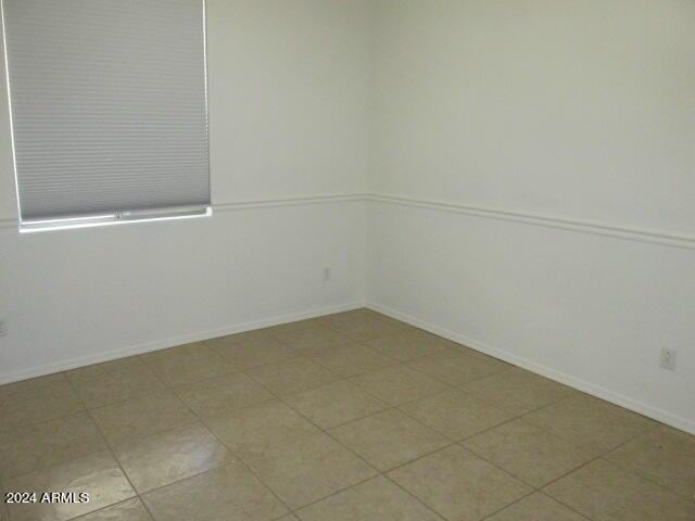 empty room with baseboards