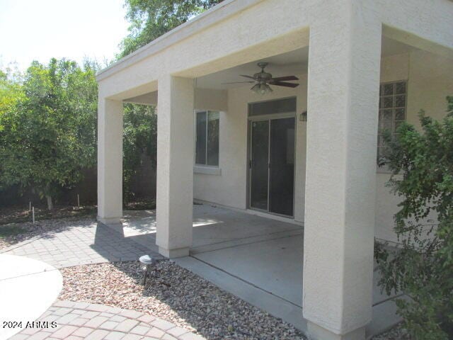 view of patio featuring ceiling fan