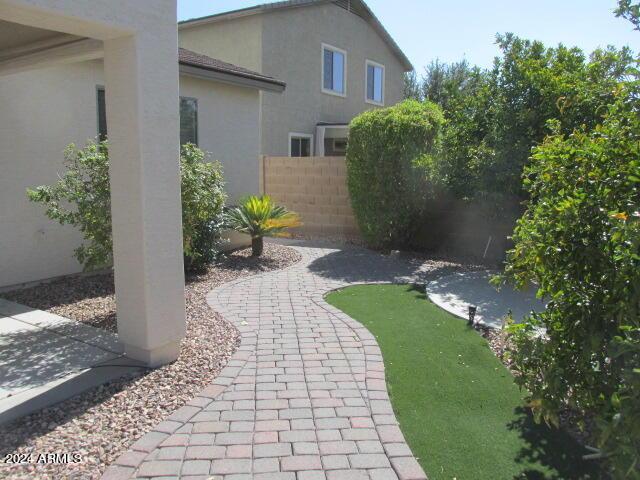 view of yard with fence and a patio