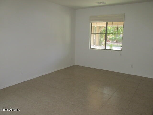 unfurnished room featuring tile patterned flooring