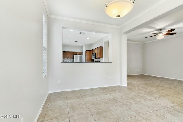 unfurnished room featuring ornamental molding, visible vents, ceiling fan, and baseboards