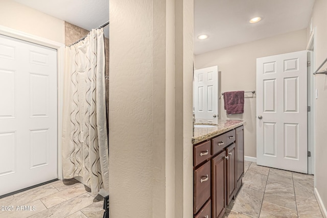 8620 E Sells Dr, Scottsdale, AZ 85251 - bathroom featuring vanity, marble look tile flooring, recessed lighting, and curtained shower