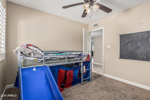 8620 E Sells Dr, Scottsdale, AZ 85251 - carpeted bedroom with a ceiling fan and baseboards