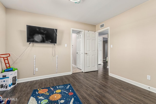 8620 E Sells Dr, Scottsdale, AZ 85251 - playroom with baseboards and wood finished floors