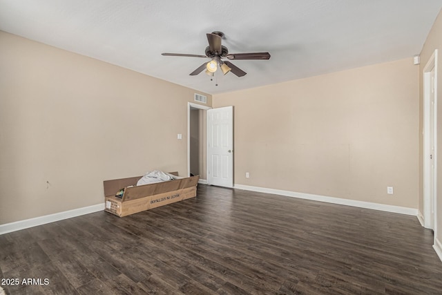 8620 E Sells Dr, Scottsdale, AZ 85251 - unfurnished room featuring a ceiling fan and dark wood-style flooring