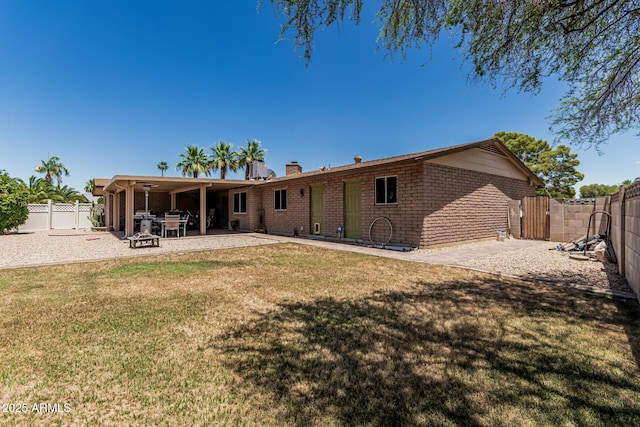 8620 E Sells Dr, Scottsdale, AZ 85251 - back of property with a patio area, a fenced backyard, and a chimney