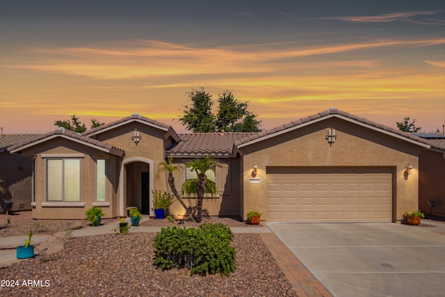 mediterranean / spanish-style home featuring a garage