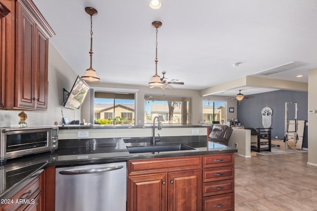 kitchen with light tile patterned flooring, stainless steel dishwasher, sink, and pendant lighting