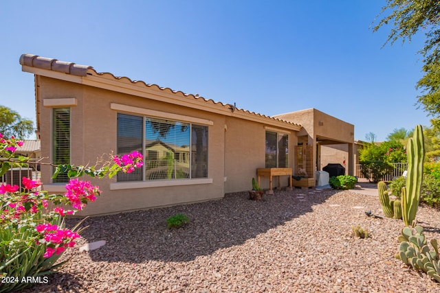 back of house featuring a patio area