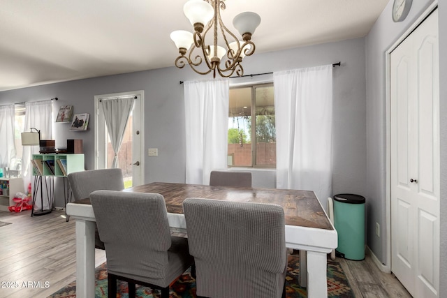 4034 E Mine Shaft Rd, San Tan Valley, AZ 85143 - dining area with a chandelier and light wood-style floors