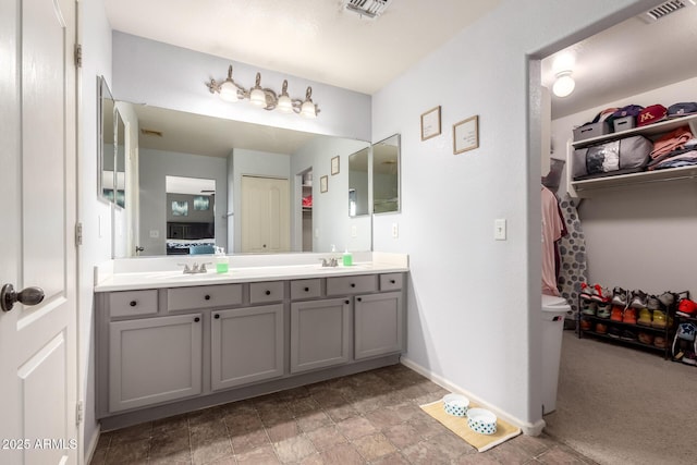 4034 E Mine Shaft Rd, San Tan Valley, AZ 85143 - bathroom with double vanity and baseboards