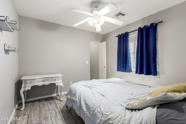 4034 E Mine Shaft Rd, San Tan Valley, AZ 85143 - bedroom featuring wood finished floors, baseboards, and ceiling fan