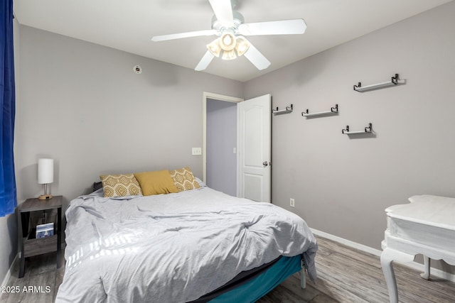 4034 E Mine Shaft Rd, San Tan Valley, AZ 85143 - bedroom featuring wood finished floors, baseboards, and a ceiling fan