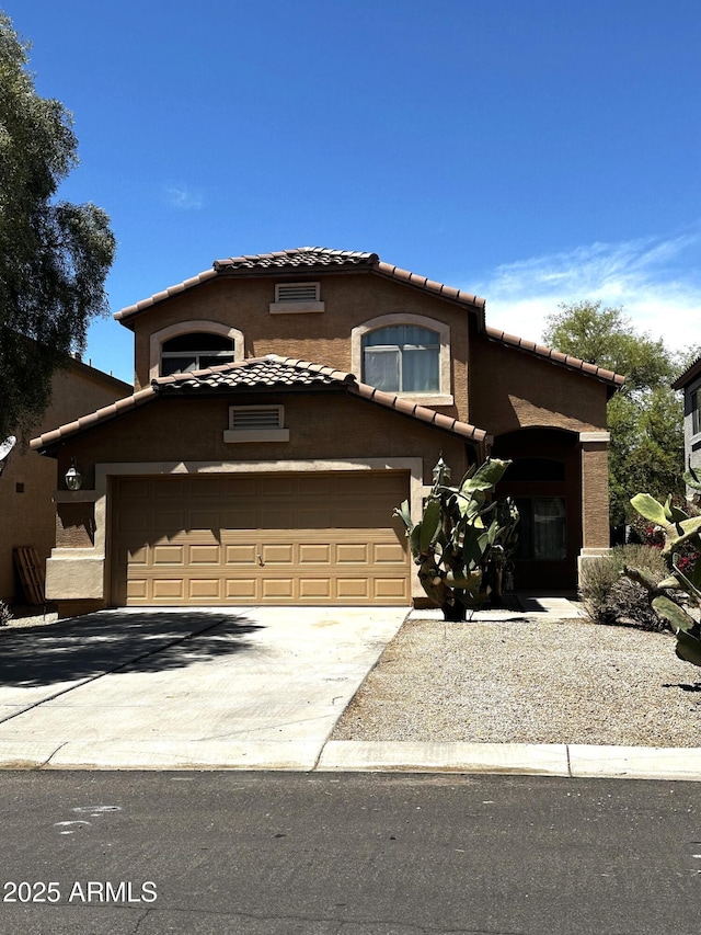 4034 E Mine Shaft Rd, San Tan Valley, AZ 85143 - view of front facade with a tiled roof, concrete driveway, stucco siding, and a garage
